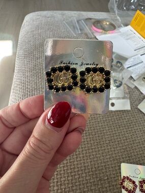 Gold-Tone Stud Earrings with Black Stone Accents